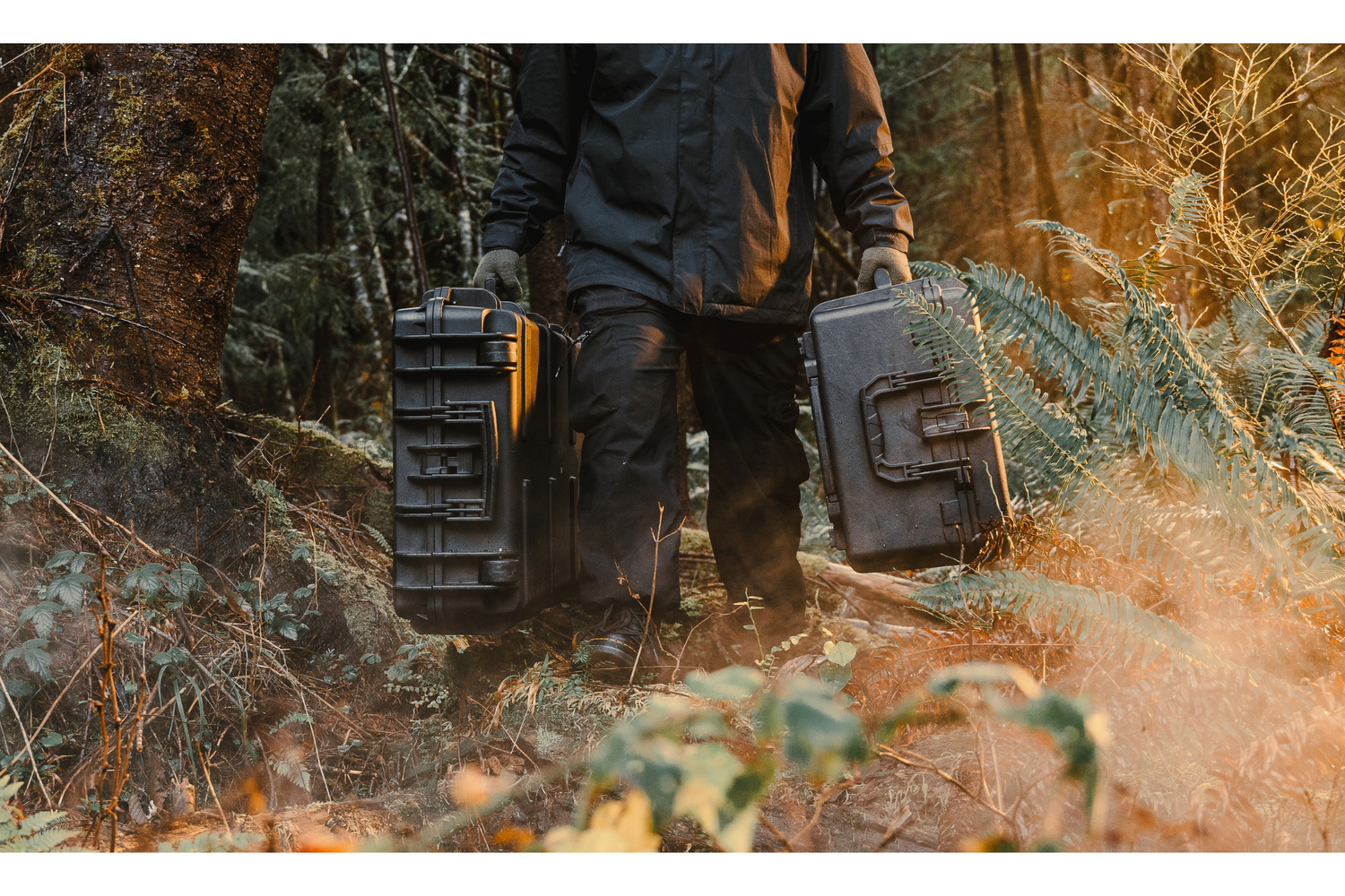 Man Holding Carry Case in Forest